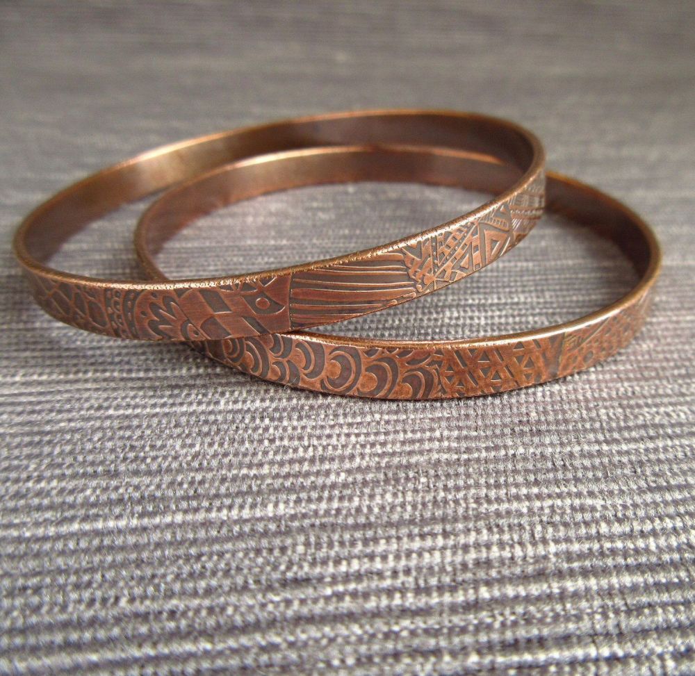 Two Copper Bangles with Embossed Surface Pattern