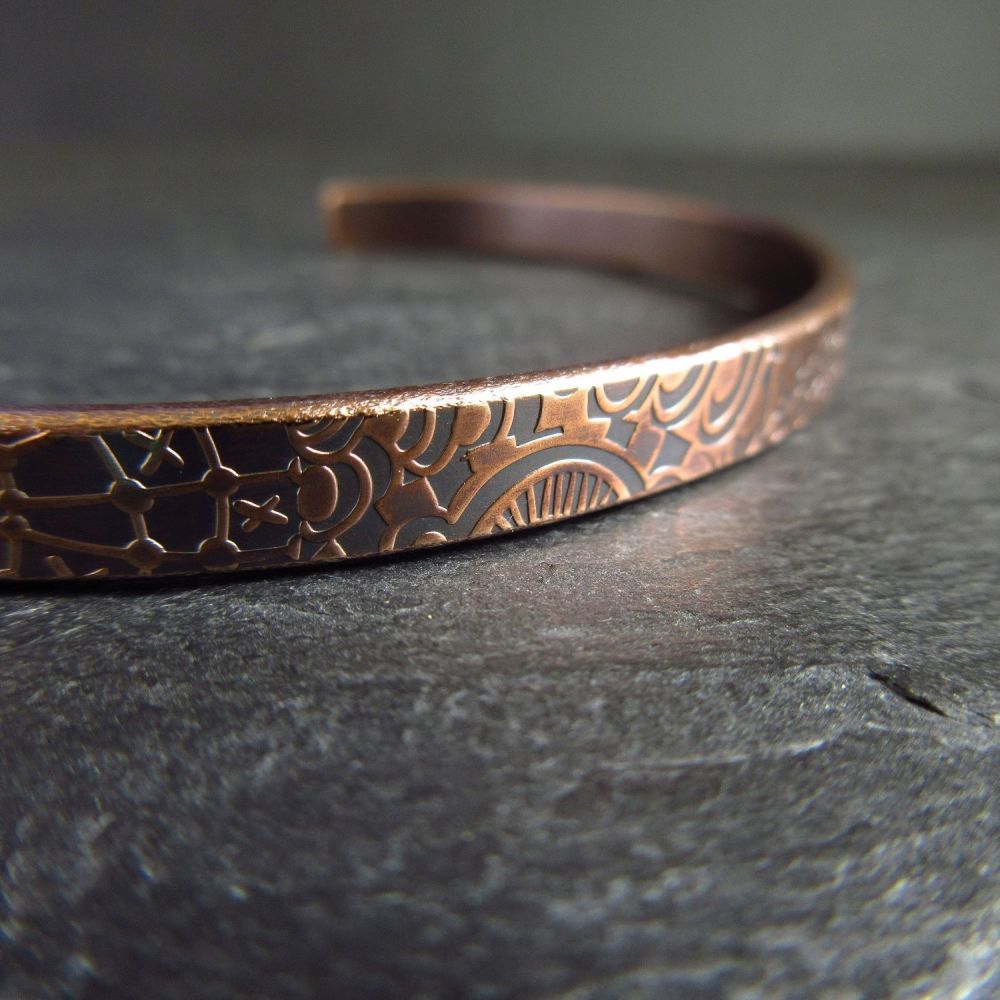 Handmade sterling silver and copper cuff bracelets