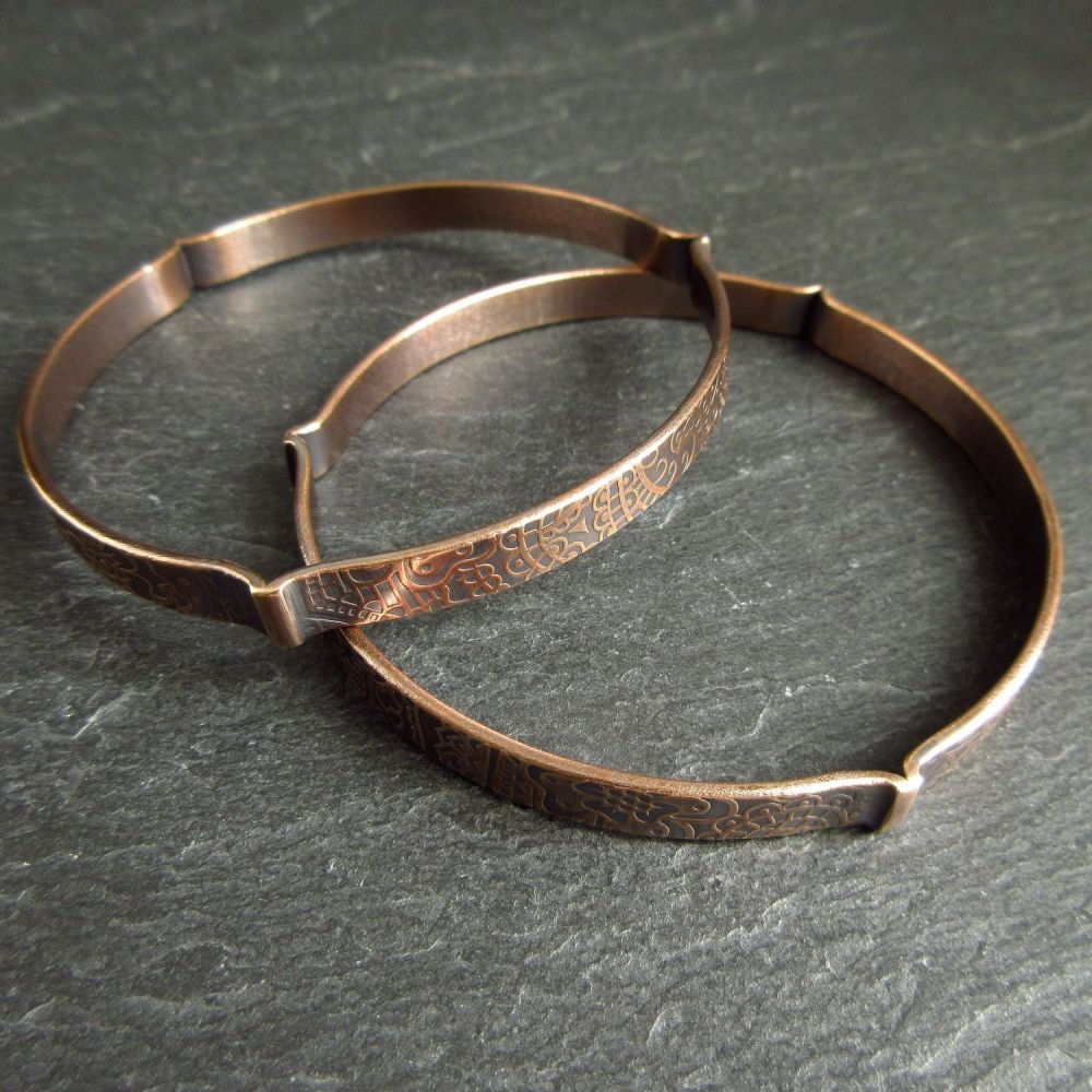Two Bronze Bangles with Flower Pattern and 3 Fold Design