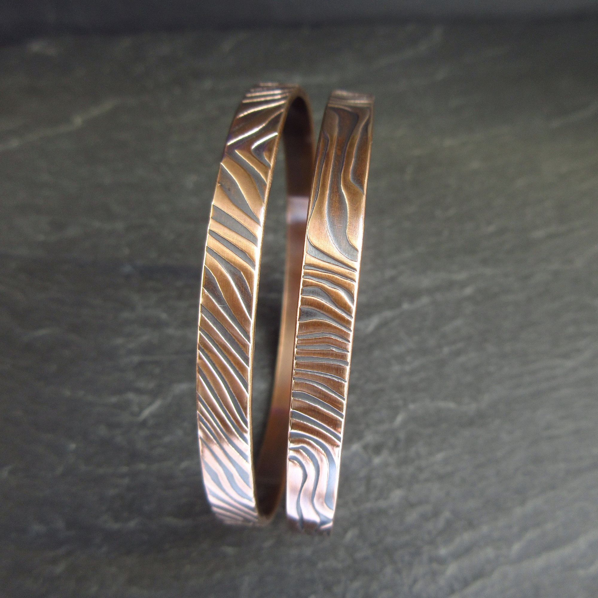bronze bangles with ripple pattern texture