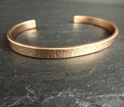 Handmade sterling silver and copper cuff bracelets