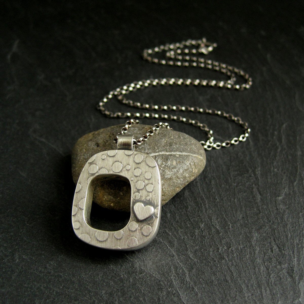 Sterling Silver Hollow Form Pendant with Silver Heart