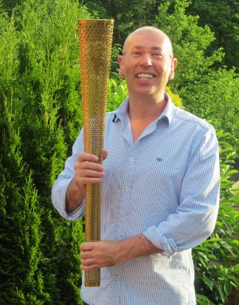 hypnotherapist mark powlett with the olympic torch