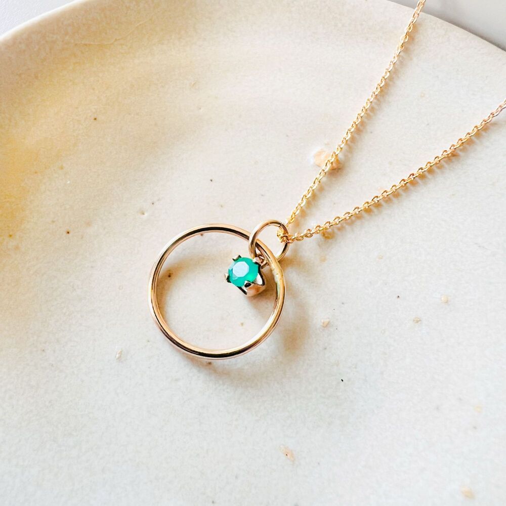Ring and gemstone necklace.