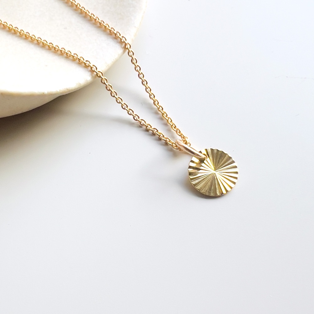 Sunburst charm necklace