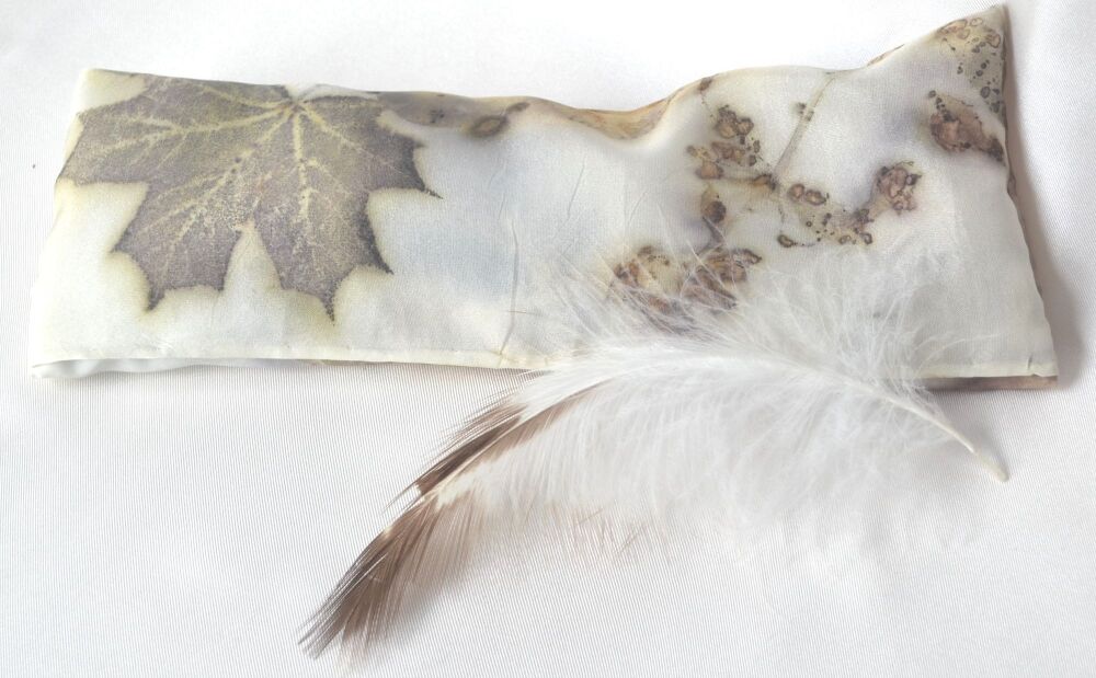 Silk eye pillow and feather