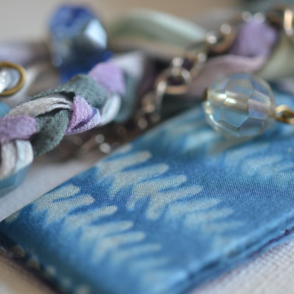 necklace detail with cyanotype and beads