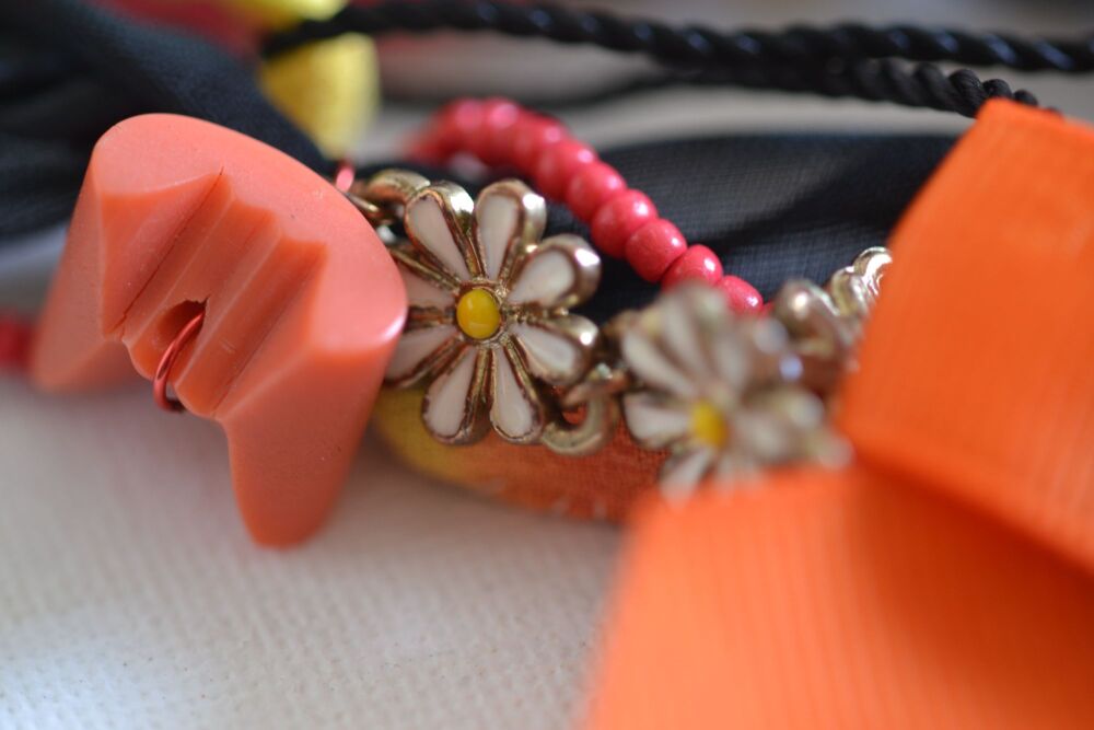 necklace detail with daisies and beads