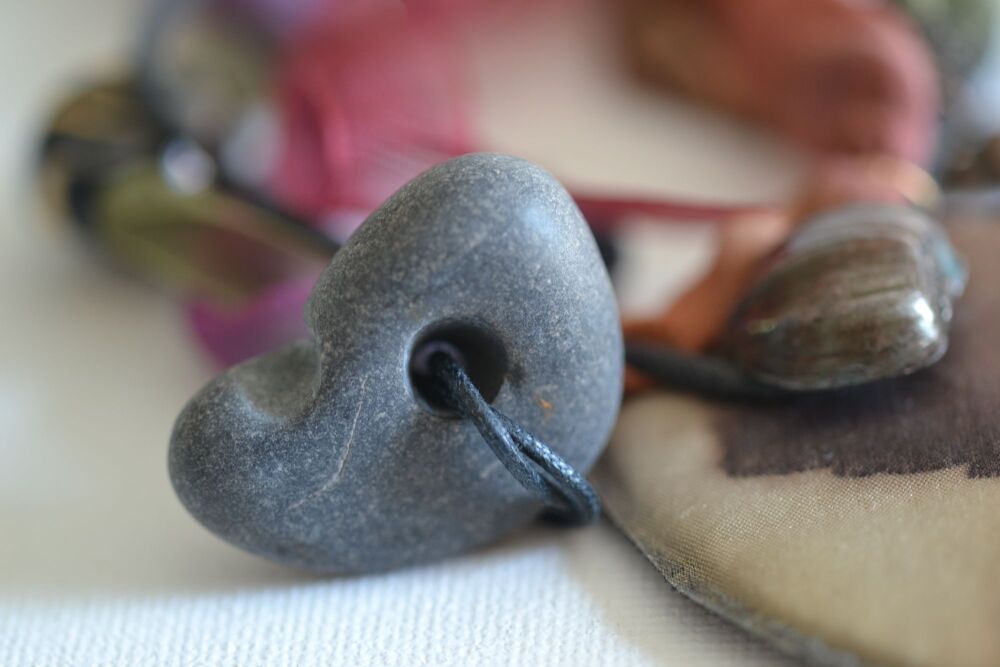 necklace detail with pebble with hole