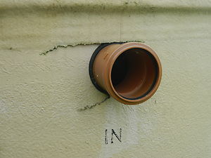 Cracked fibreglass around the outlet pipe.