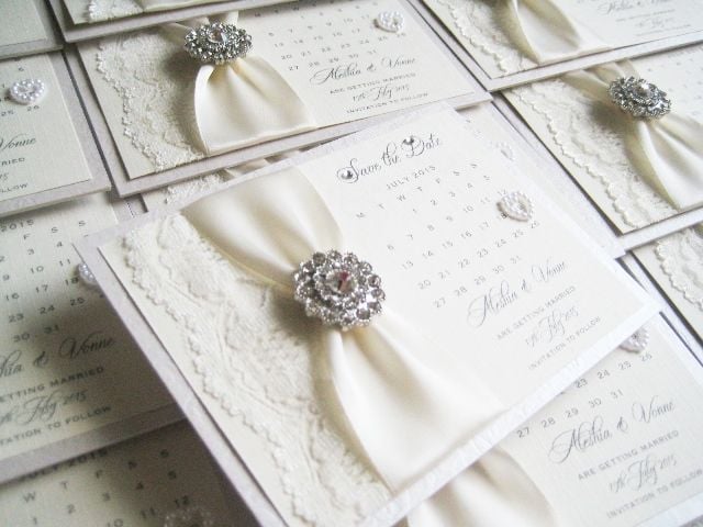 Vintage style save the date wedding calendar decorated with vintage crystal brooch and ivory lace