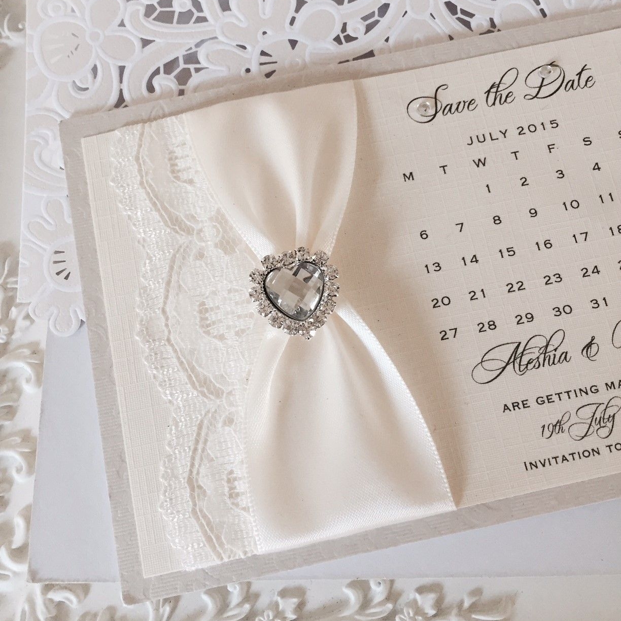 Ivory save the date wedding calendar with lace and diamante heart