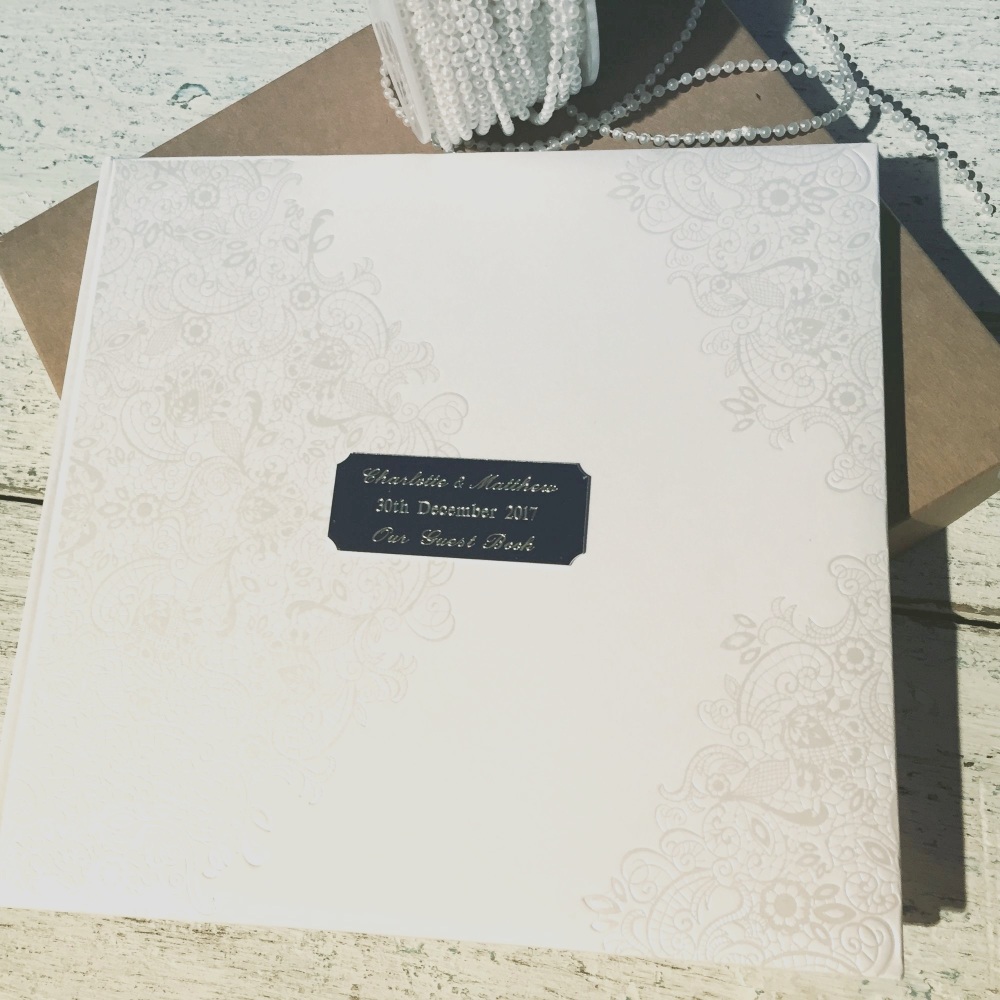 Personalised guest book in white embossed with names