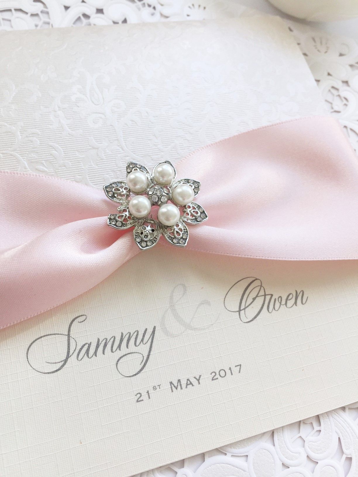Boxed luxury invitation with blush pink ribbon