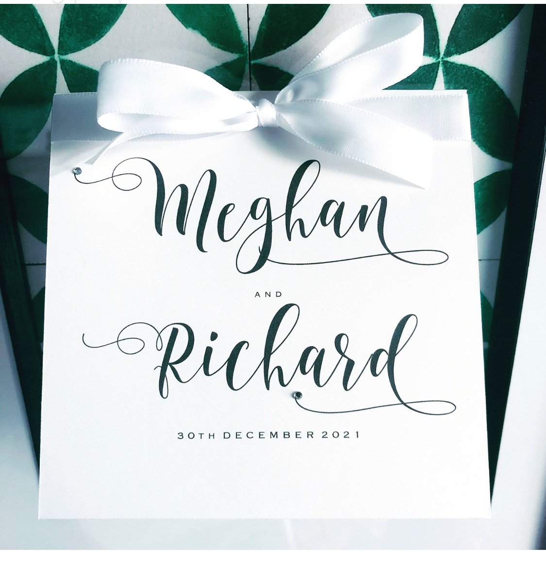White wedding invitations with beautiful swirly fonts