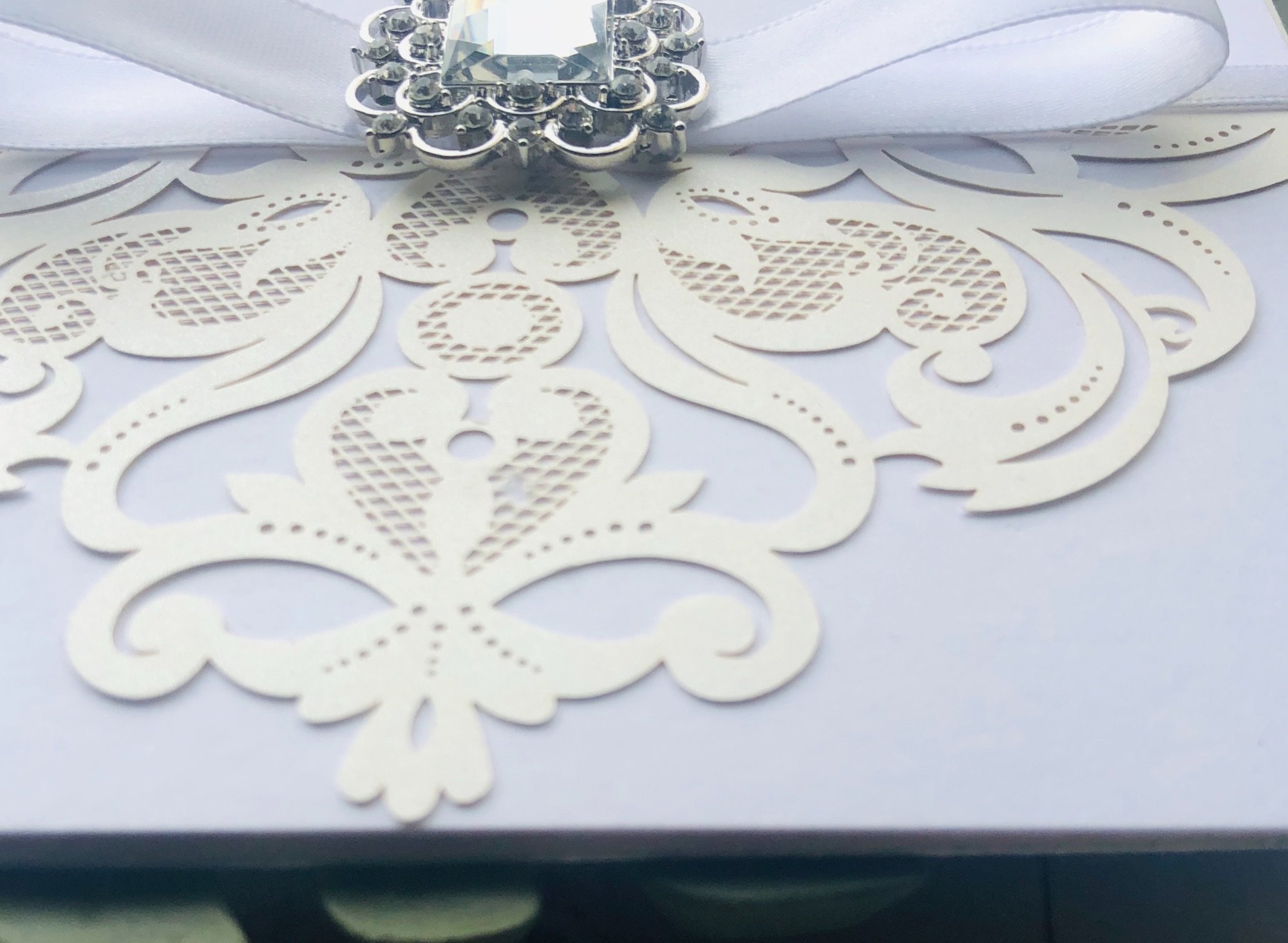 Invitation with crystal brooch