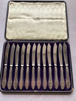 Cased set of 12 antique silver handled butter knives by Walker & Hall