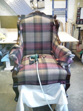 antique chair getting upholstered