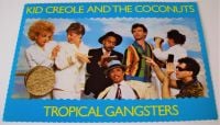 KID CREOLE AND THE COCONUTS U.K. RECORD COMPANY PROMO POSTCARD FOR THE ALBUM 'TROPICAL GANGSTERS' 1982