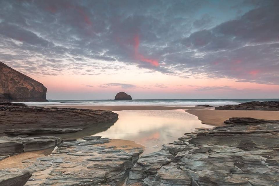 Pink sunset at Trebarwith Strand beach