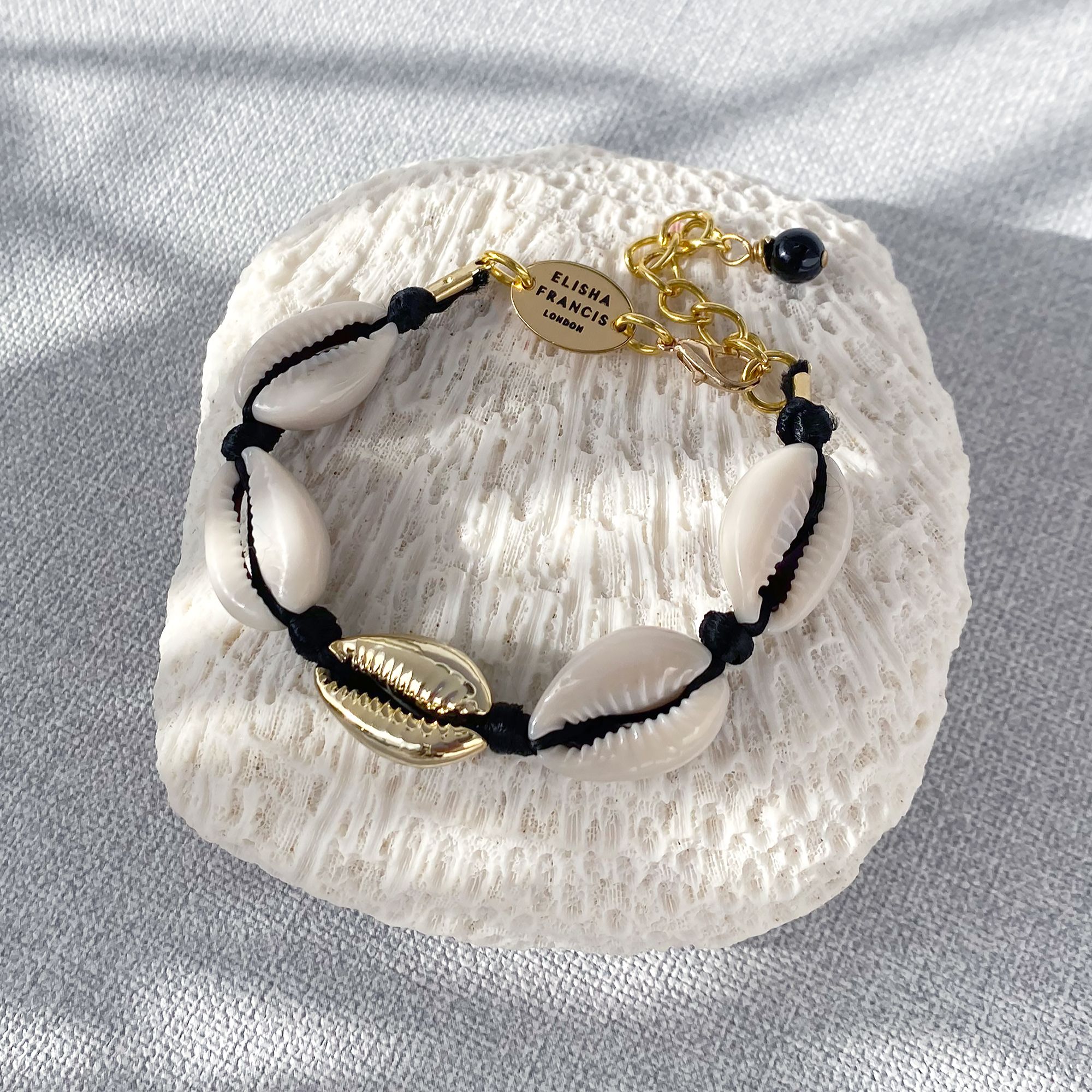 black cowrie bracelet - gold nugget.jpg