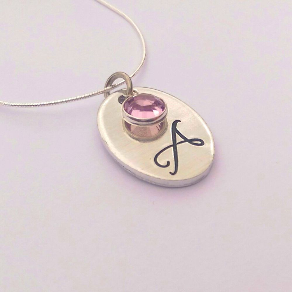 Hand stamped personalised oval initial necklace with swarovski crystal birt
