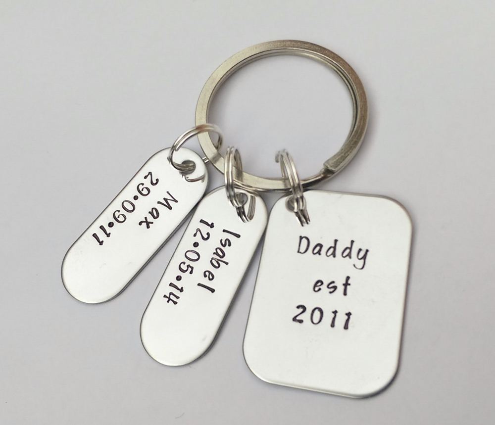 Hand stamped personalised Daddy Est. keyring with name and date tags