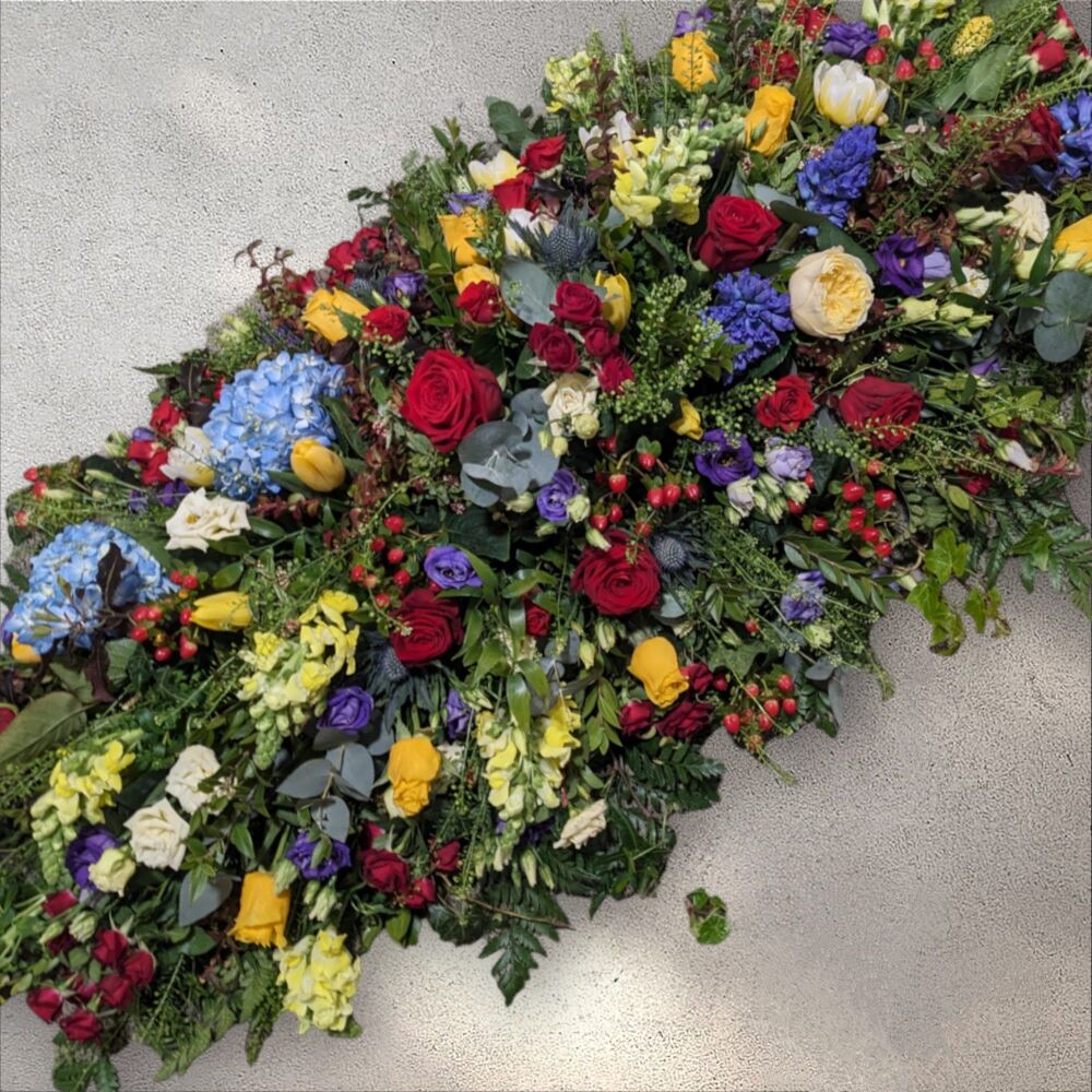 Red, yellow and blue natural coffin spray
