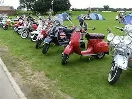 Line of classic Lambretta and Vespa scooters on display at Lincolnshire Showground
