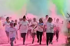 Lincolnshire Colour Run with participants covered in coloured powder â festival and event cleaning by Clean Sweep Commercial