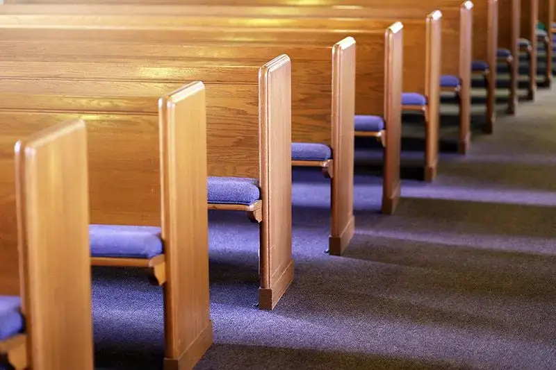 Clean and polished wooden church pews in Retford ready for service