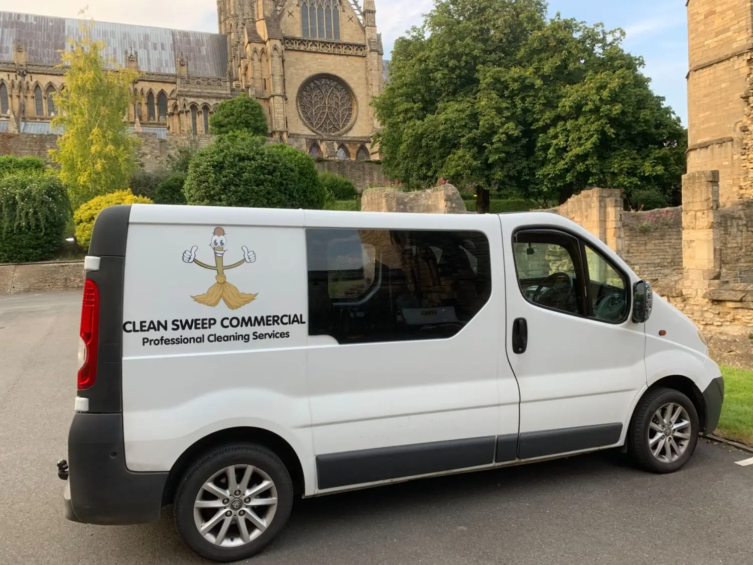 Clean Sweep Commercial branded van parked near historic Lincoln buildings during the daytime