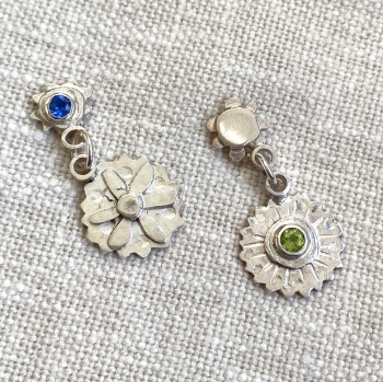 Mismatched Silver Stud earrings with Flower Drops and Facetted Blue and Green Gemstones.