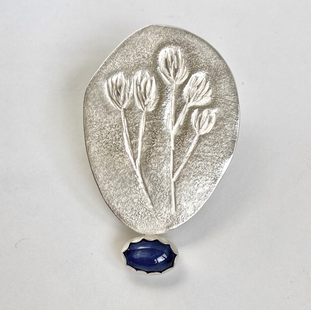 Silver Seed-head Brooch with Blue Sapphire Gem.