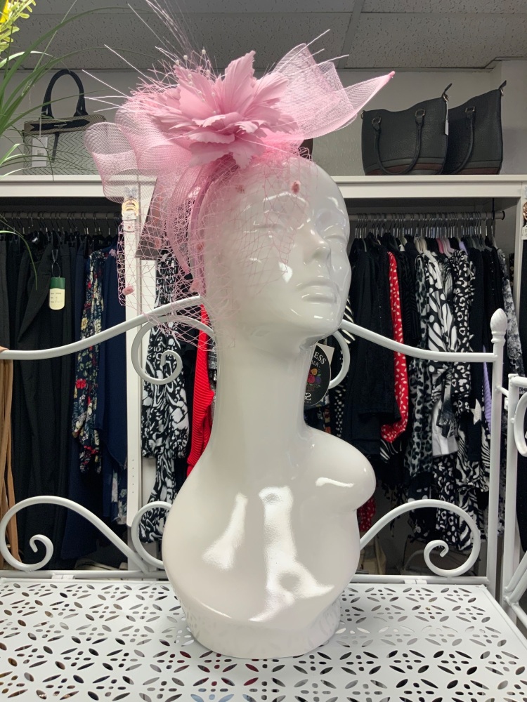 Pink fascinator on head band