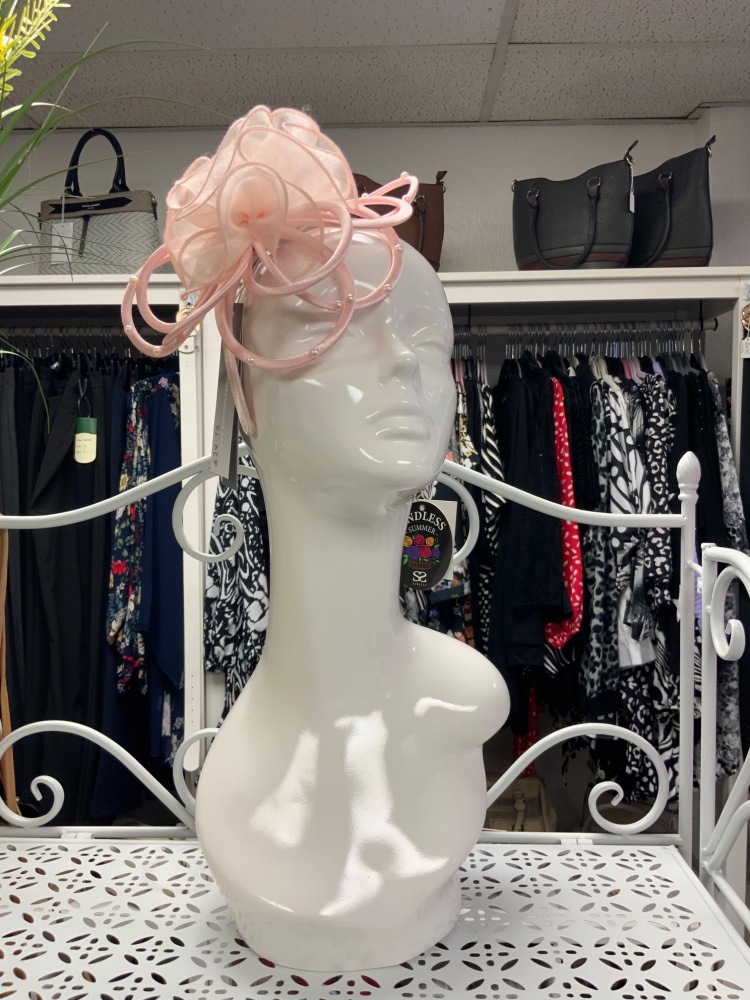 Pink fascinator on headband