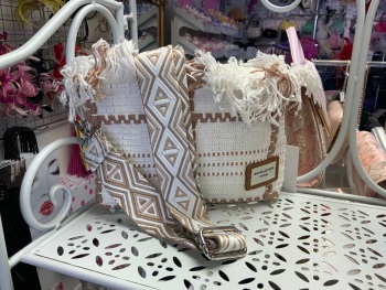 New Product….creamy white material cross the body bag with fringing