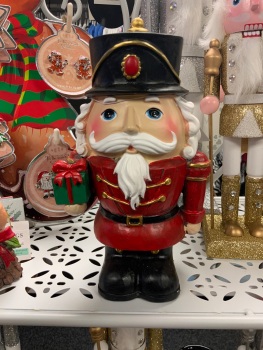 New Product….resin wood effect nutcracker carrying a present