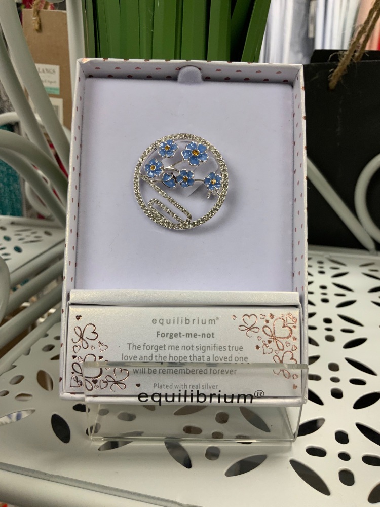 New Product….equilibrium silver plated circular forget me not brooch