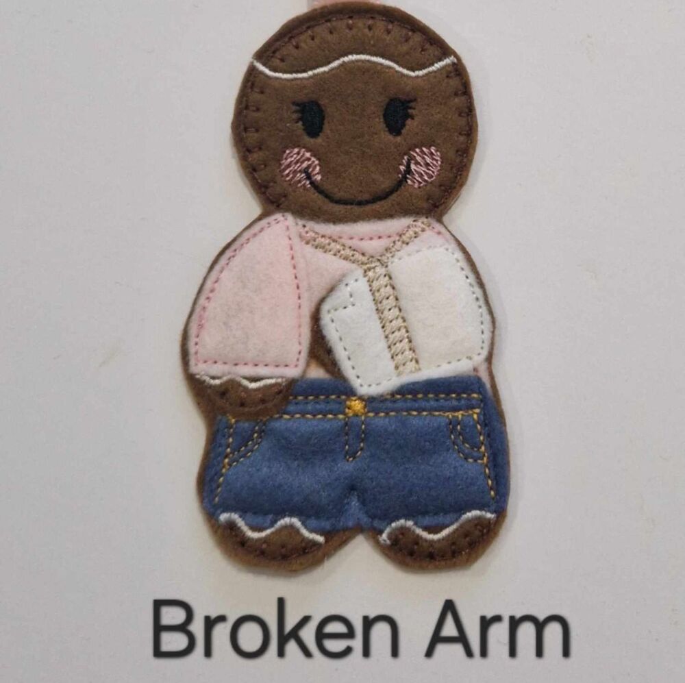 Broken Arm Gingerbread Decoration. Available as a Hanging decoration, Keyring/Bag charm Or fridge magnet