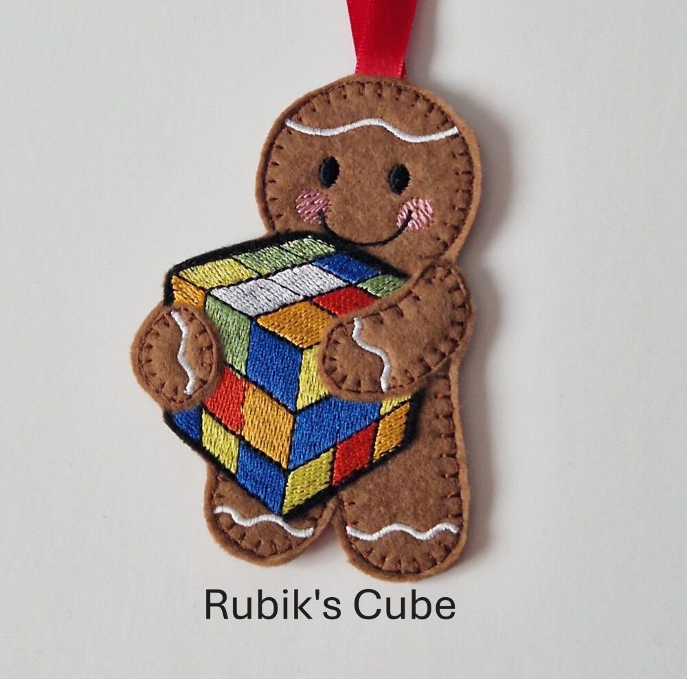 Rubik's Cube Holding Gingerbread Decoration. Available as a Hanging decoration, Keyring/Bag charm Or fridge magnet