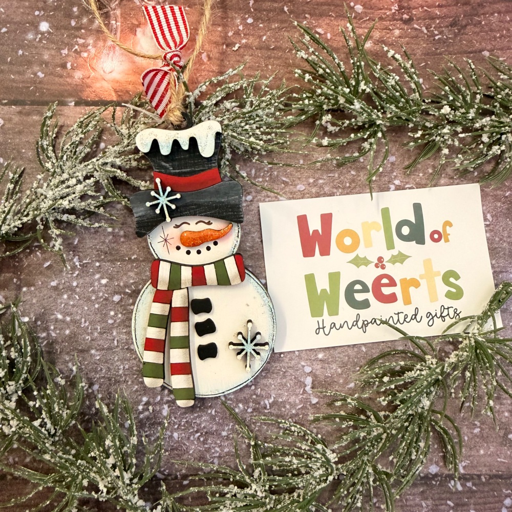 small snowman with a stripy scarf