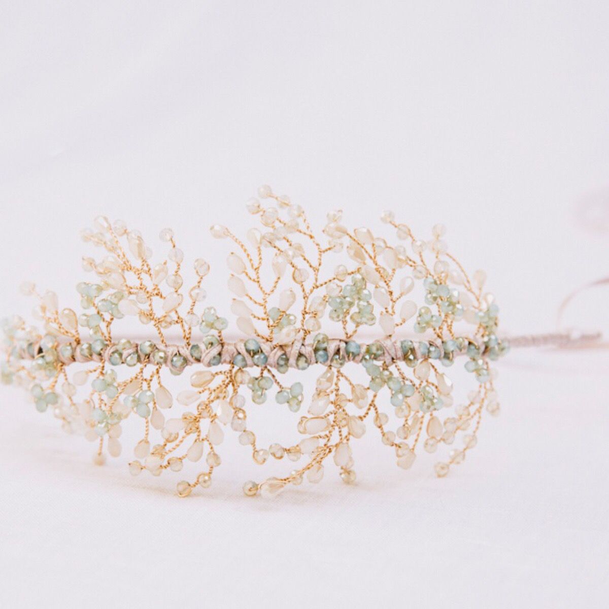 Lightweight and comfortable wedding headdress with side detail of pale blue and taupe crystals