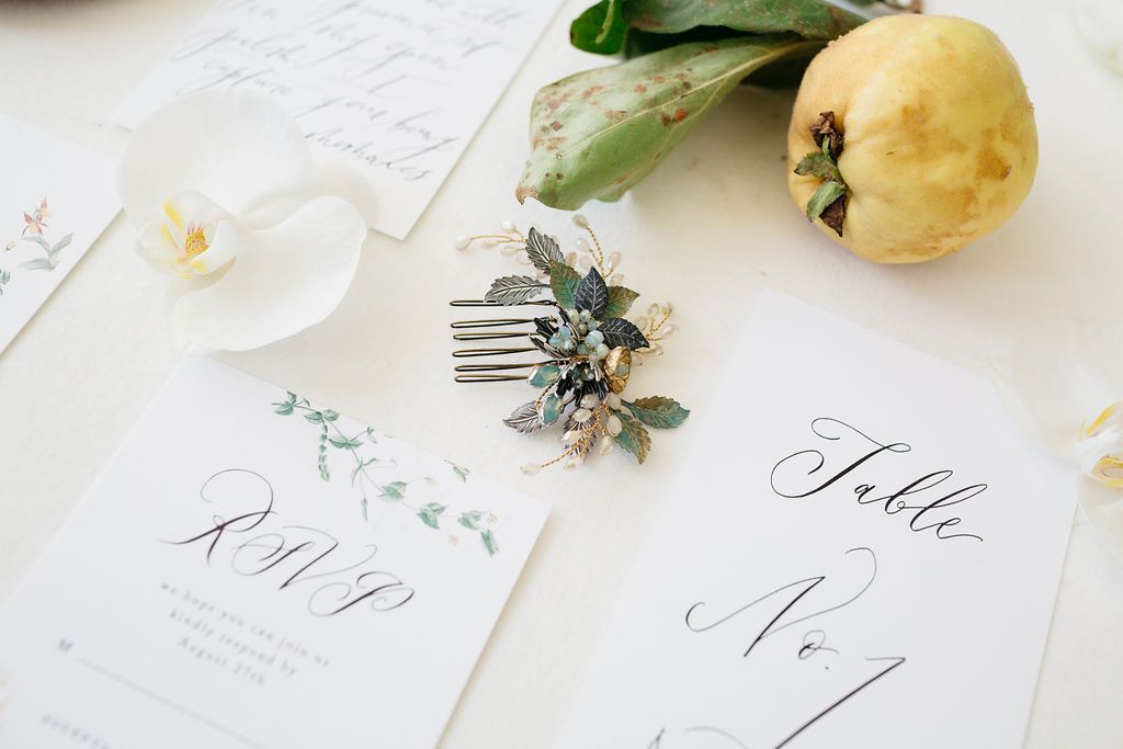A delicate antique silver wedding comb and hand written calligraphy