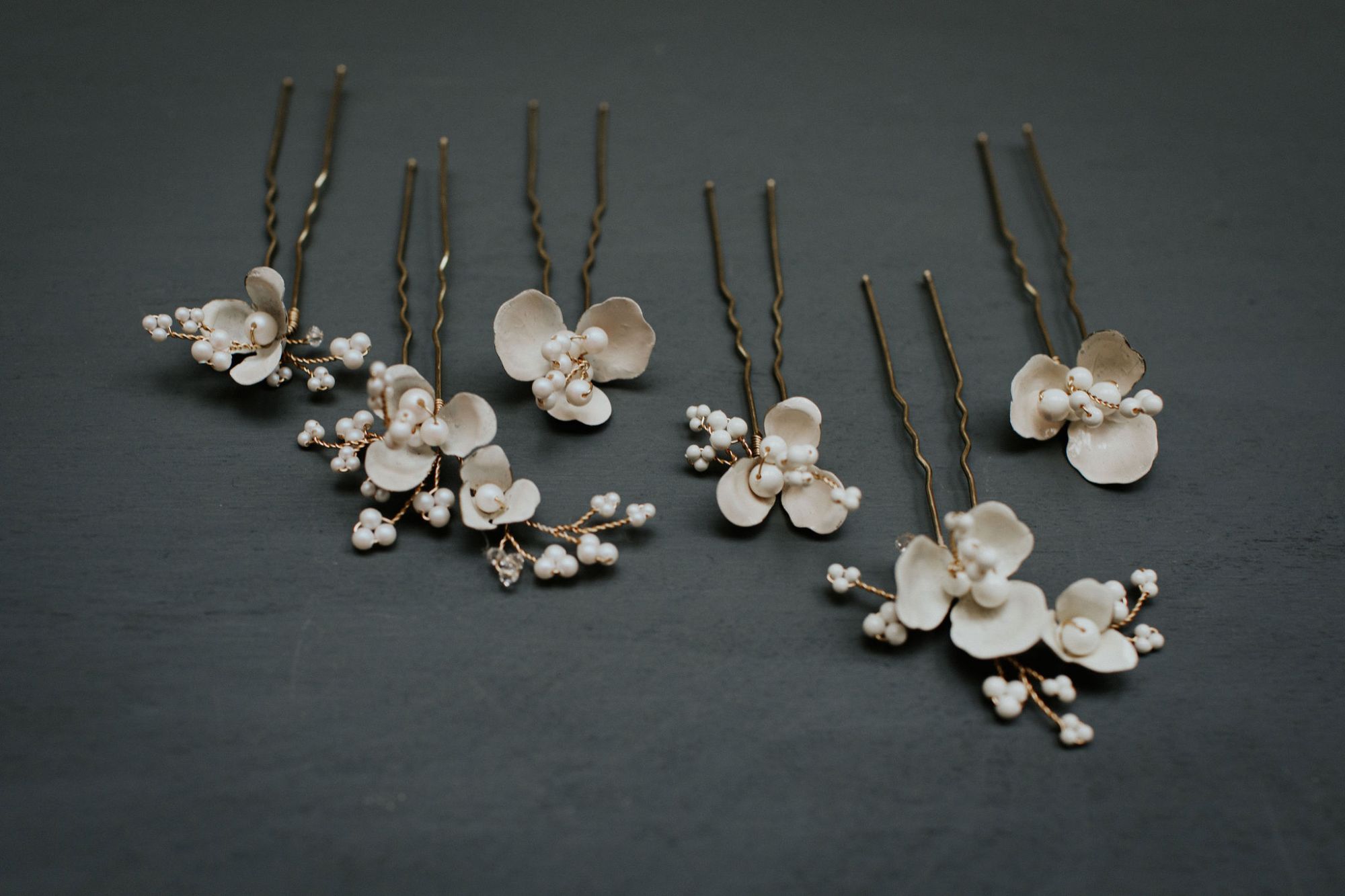 White floral Anemone bridal hair pins handmade by Clare Lloyd Accessories