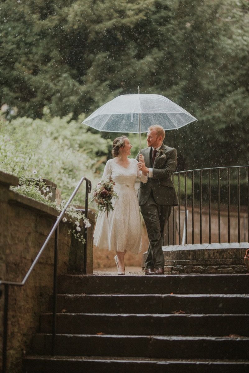 Bride and Groom marrying in the rain