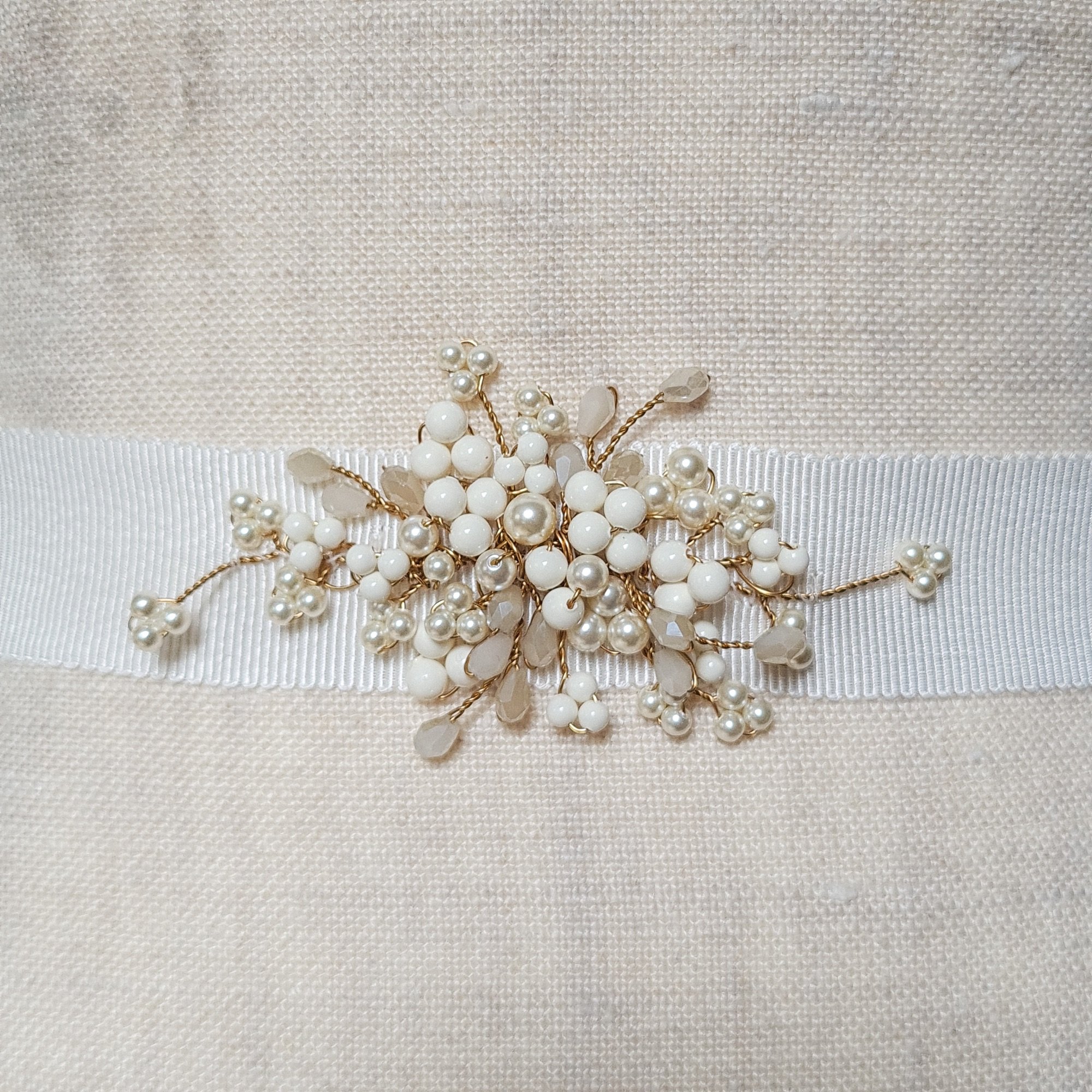 bespoke bridal sash made from ivory gloss pearls with champagne crystal