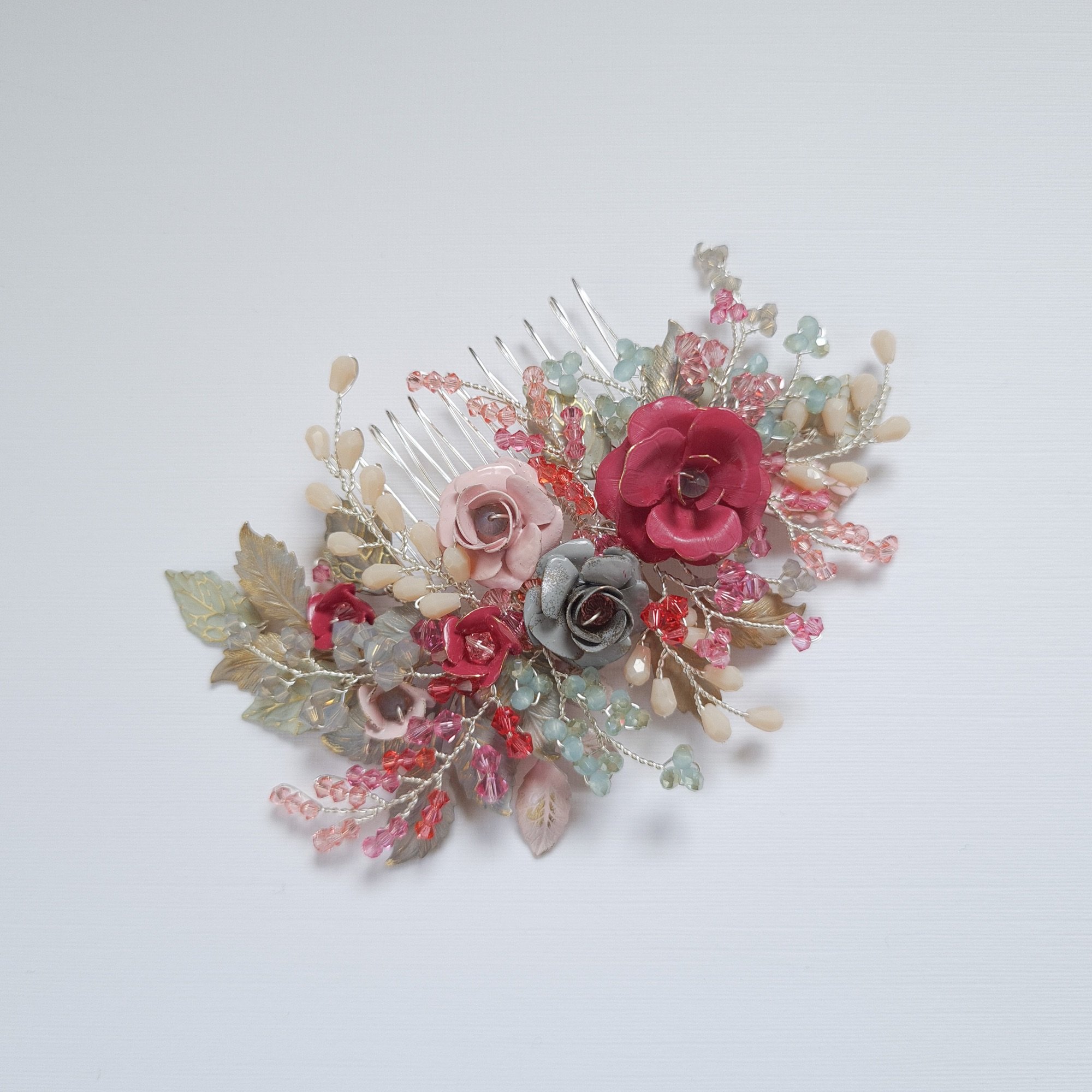 Bespoke floral wedding hair comb in shades of pink grey and coral