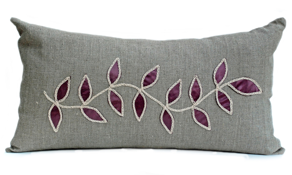 Linen cushion with steel leaf design