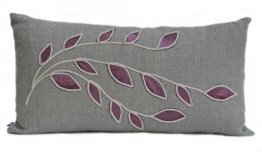 Linen cushion with plum leaf design